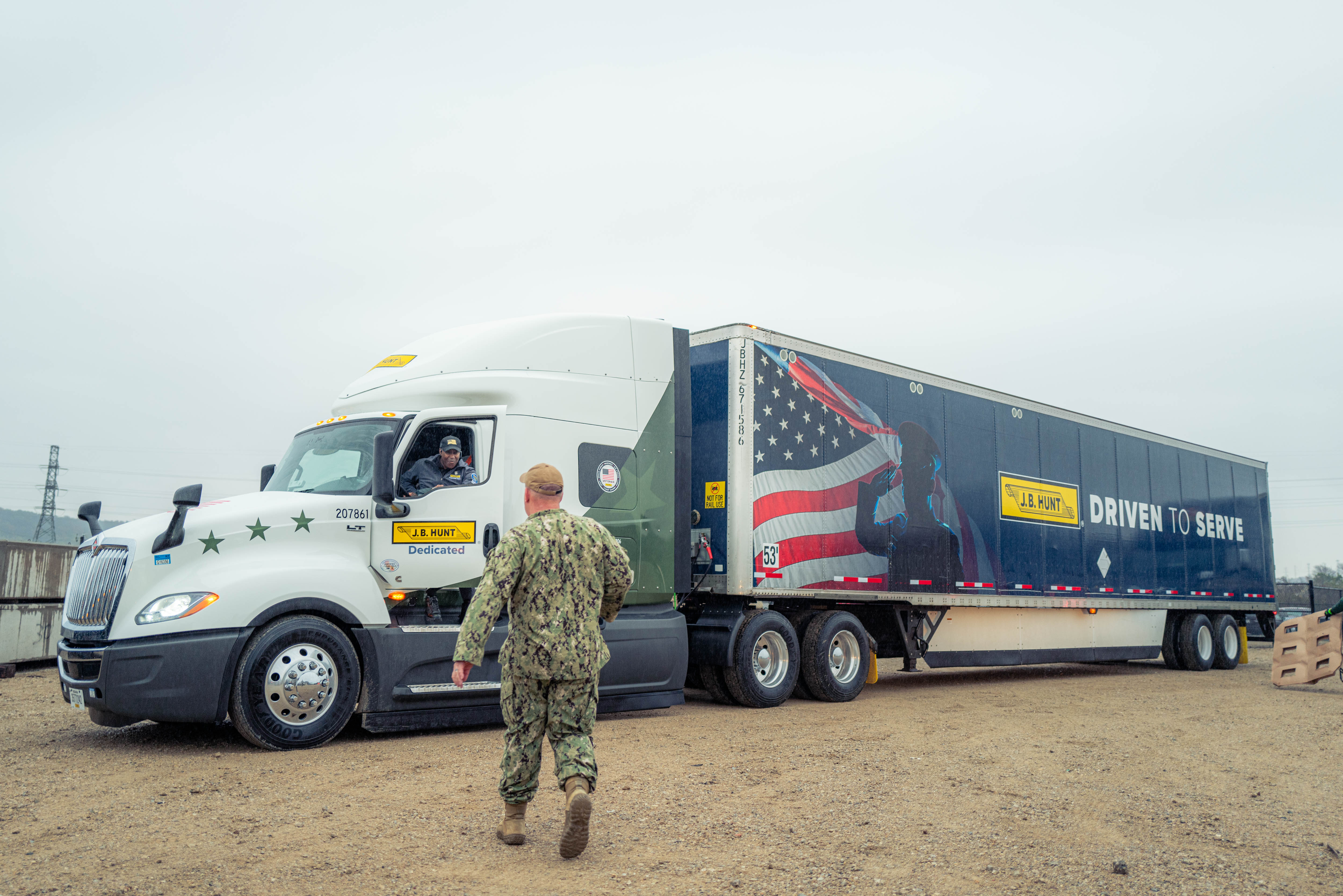 J.B. Hunt truck driver arrives to deliver a load of wreaths at the Dallas-Fort Worth National Cemetery for the 2023 Wreaths Across America Day.